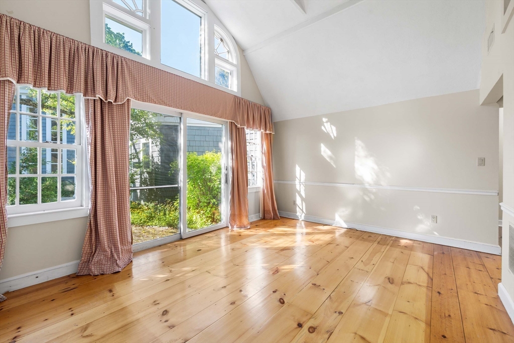 2 Foster Street Marblehead, MA 01945 - Photo 31 of 42 a view of an empty room with wooden floor and a window