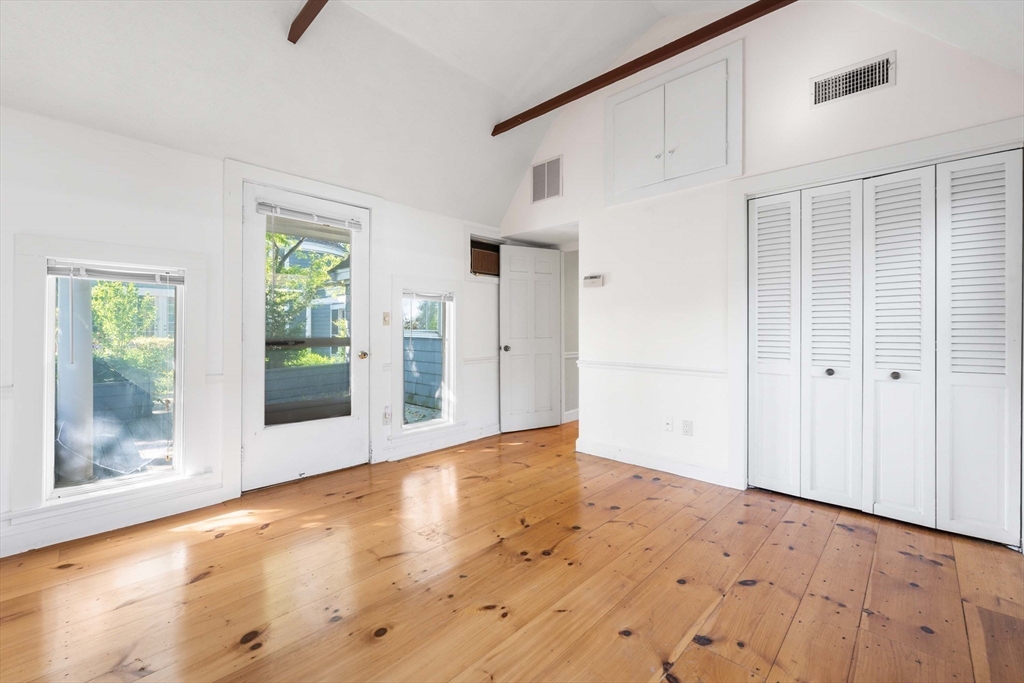 2 Foster Street Marblehead, MA 01945 - Photo 33 of 42 a view of an empty room with wooden floor and a window