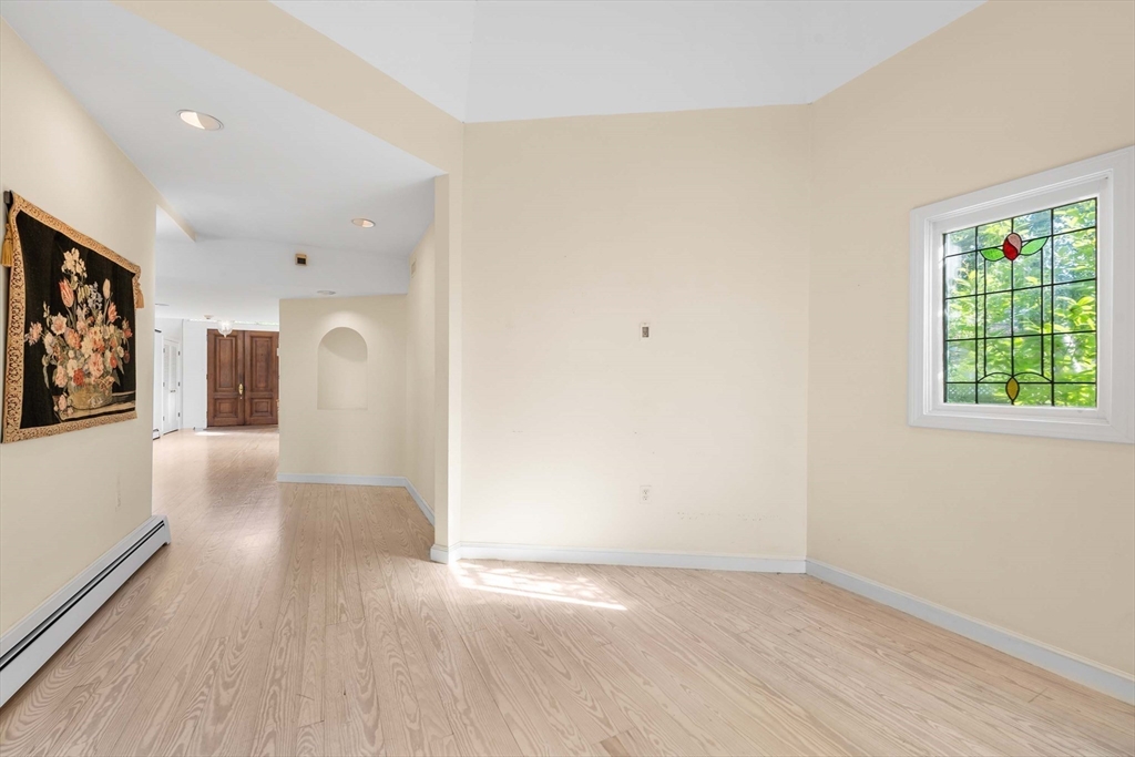 2 Foster Street Marblehead, MA 01945 - Photo 8 of 42 wooden floor in an empty room with a window