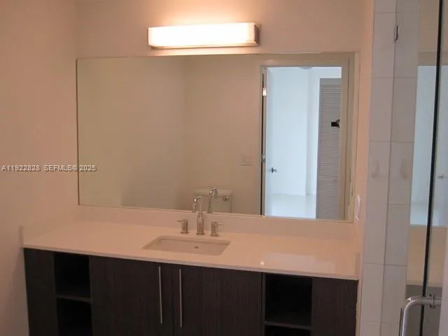 a bathroom with a sink and a mirror