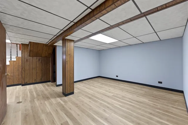 a view of a room with wooden floor
