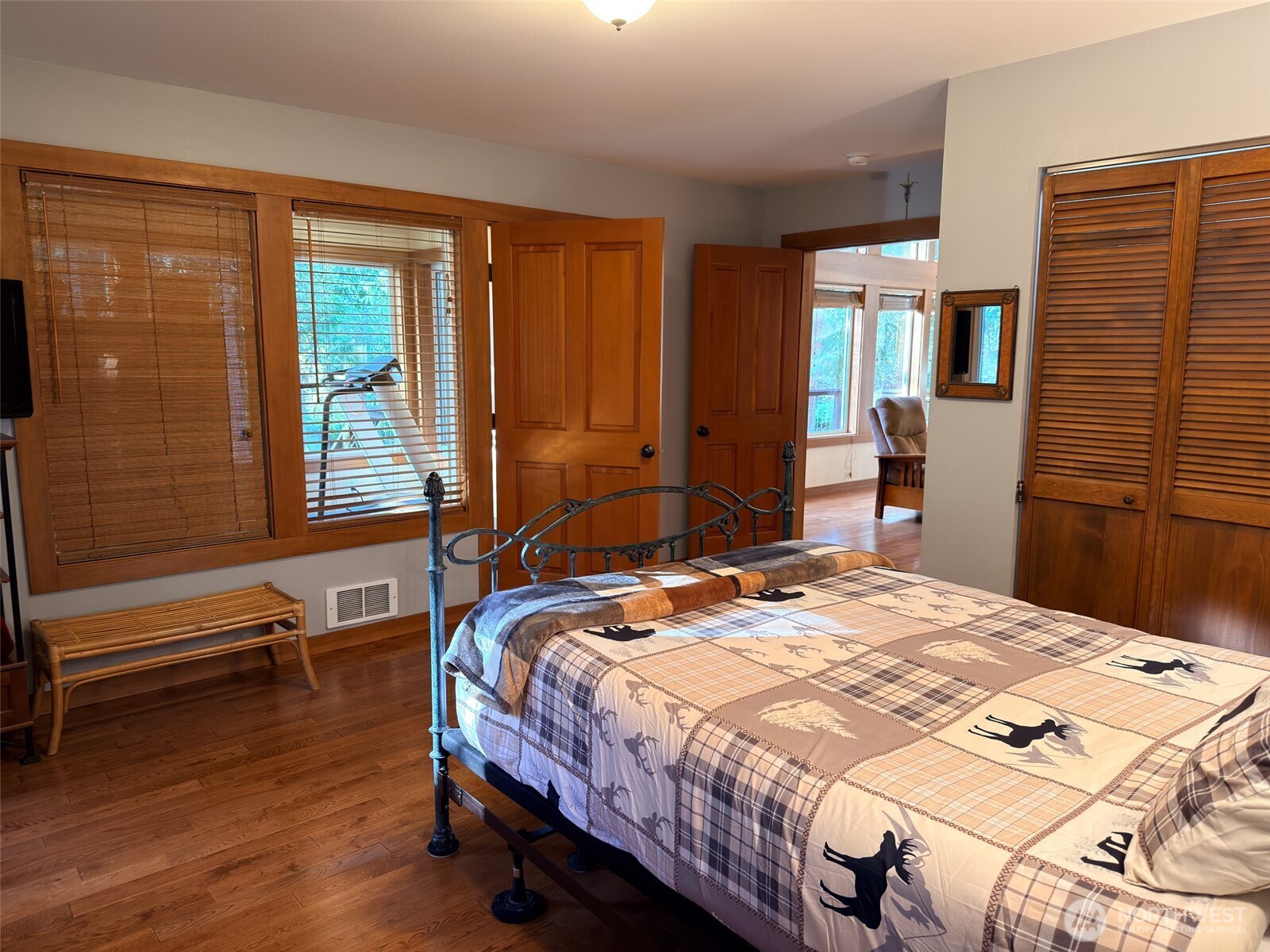 140 Gybe Ho Road Nordland, WA 98358 - Photo 12 of 38 a bedroom with a bed and a dresser next to a window