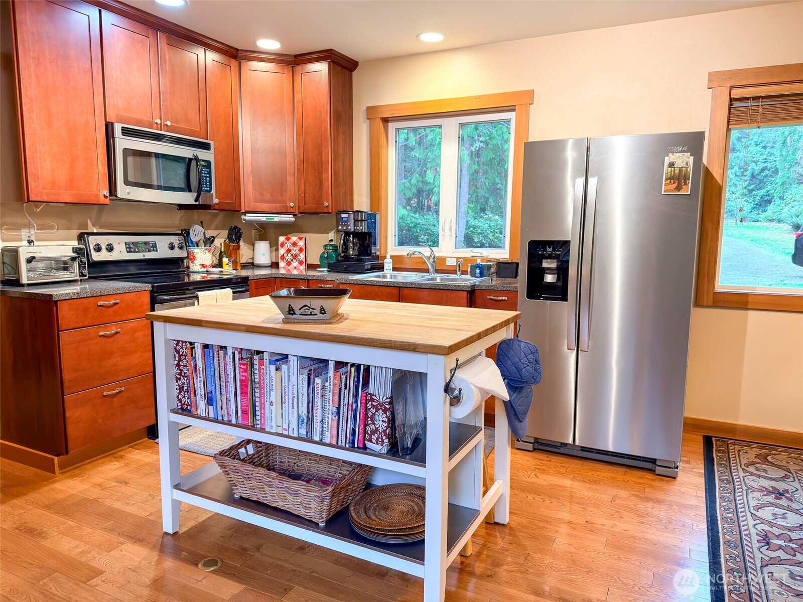 140 Gybe Ho Road Nordland, WA 98358 - Photo 10 of 38 a kitchen with stainless steel appliances granite countertop a refrigerator a stove a sink and a microwave