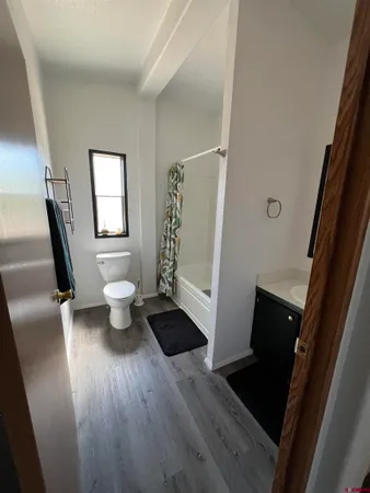 workspace with wooden floor and window