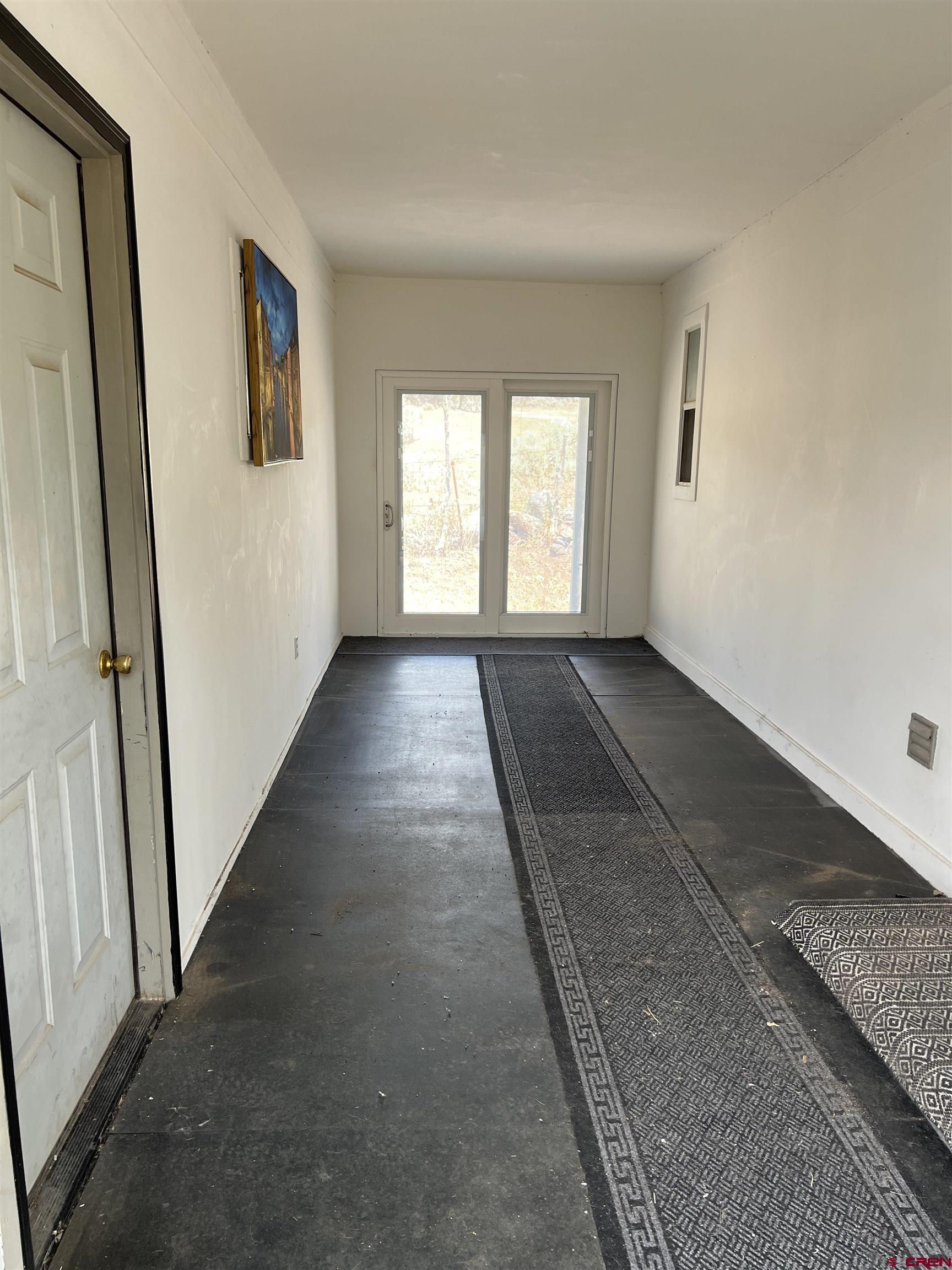 20246 2375th Road Cedaredge, CO 81413 - Photo 17 of 18 an empty room with windows