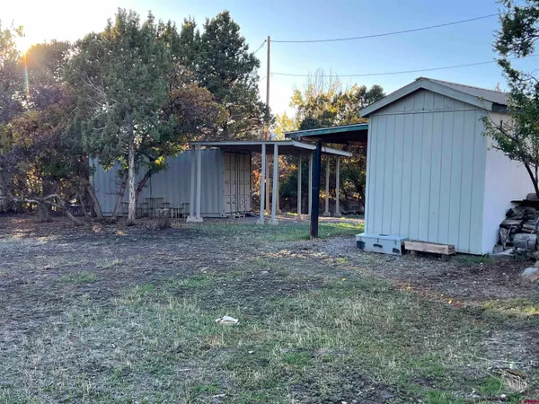 a house with trees in the background