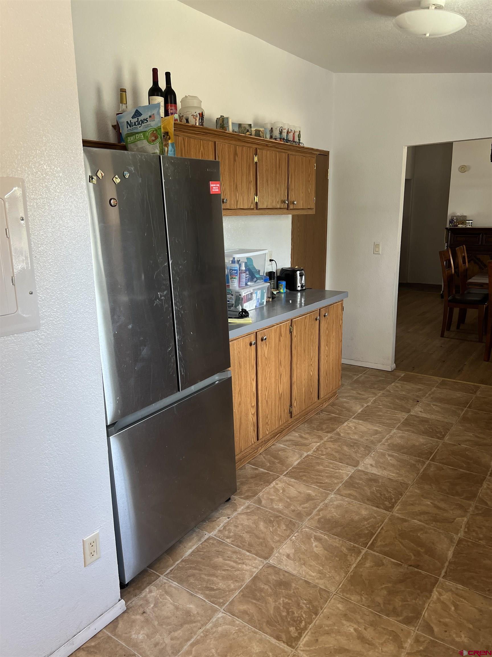 20246 2375th Road Cedaredge, CO 81413 - Photo 8 of 18 a kitchen with stainless steel appliances granite countertop a refrigerator and a stove