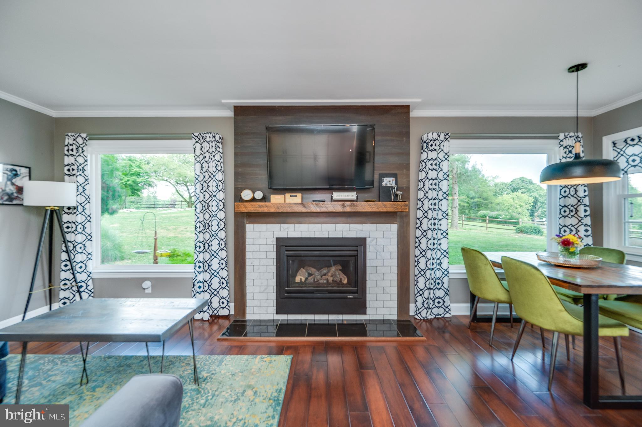 1703 Golf Road Reading, PA 19601 - Photo 28 of 70 The rear windows frame the fireplace and are huge!