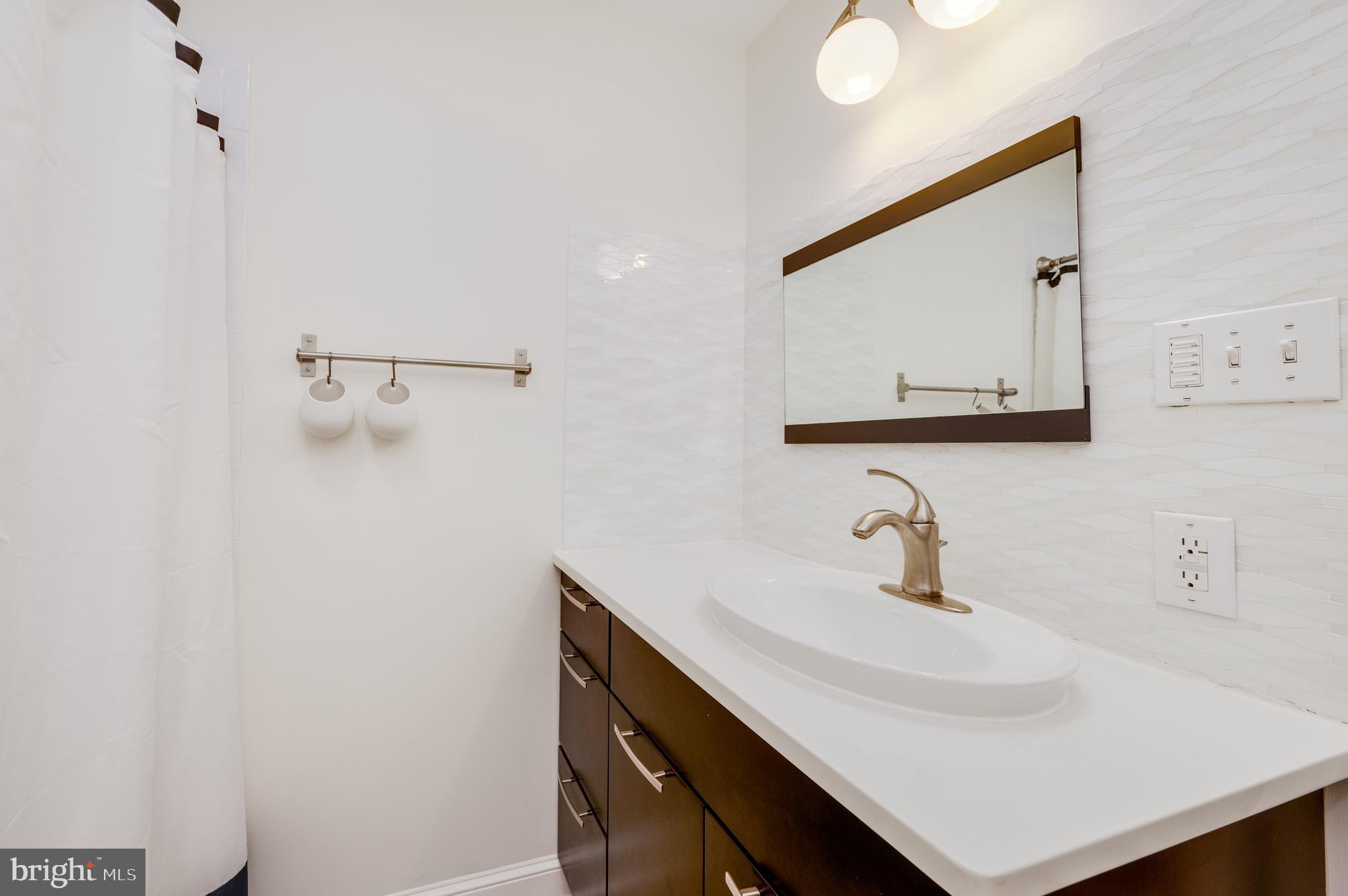 1703 Golf Road Reading, PA 19601 - Photo 36 of 70 Quartz top vanity with glass tile backsplash