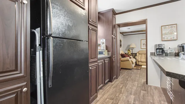 a kitchen with granite countertop a sink a stove and a cabinets