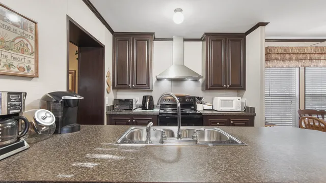a bathroom with a sink and a large mirror