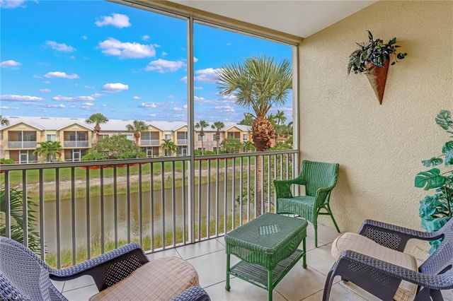 a view of a balcony with furniture