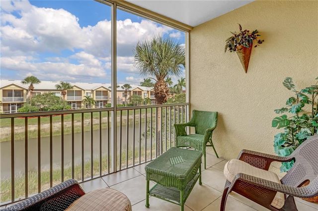 a view of a balcony with chairs