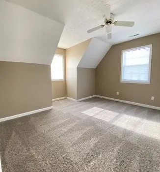 a view of a house with backyard