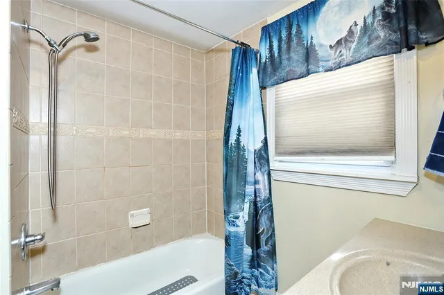 a bathroom with a toilet and shower