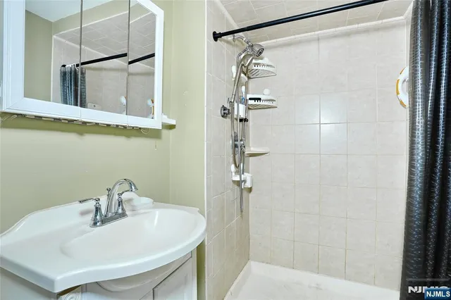 a bathroom with a sink and mirror