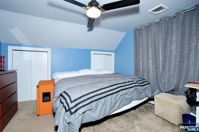 a bedroom with bed and window