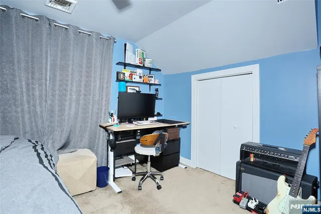 a view of a workspace with furniture