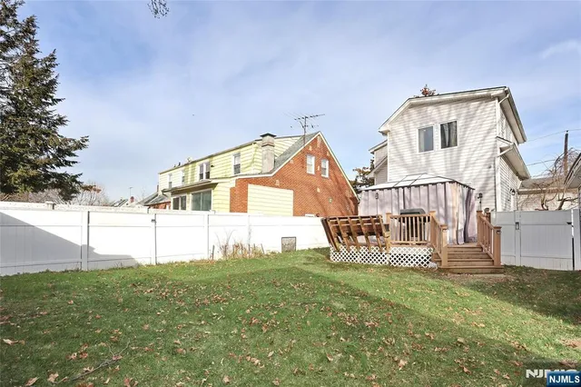 a view of a house with a yard porch and sitting area