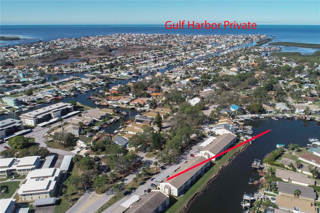 4533 Marine Parkway, Unit 206 New Port Richey, FL 34652 - Photo 17 of 22 an aerial view of residential houses with outdoor space