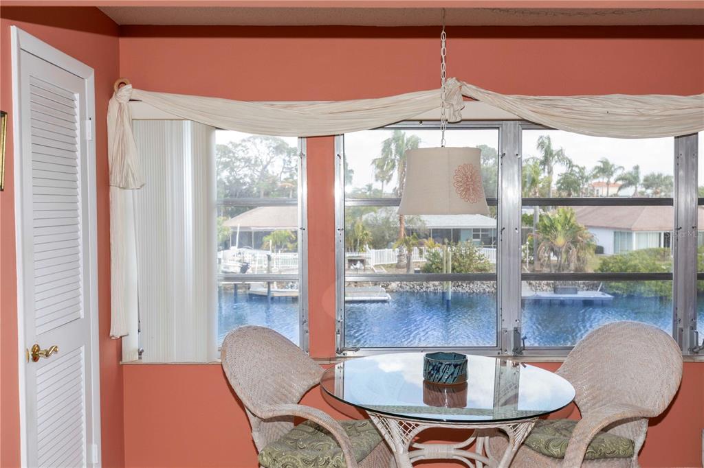 4533 Marine Parkway, Unit 206 New Port Richey, FL 34652 - Photo 2 of 22 a dining room with furniture and window