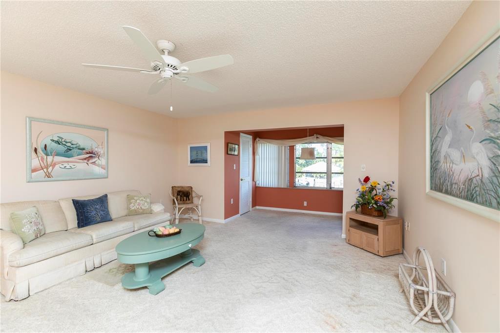4533 Marine Parkway, Unit 206 New Port Richey, FL 34652 - Photo 8 of 22 a living room with furniture and window