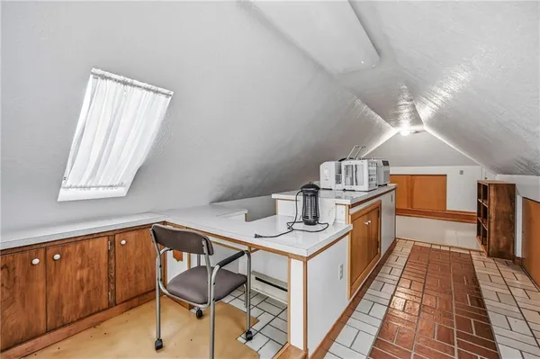a kitchen with granite countertop sink cabinets and window
