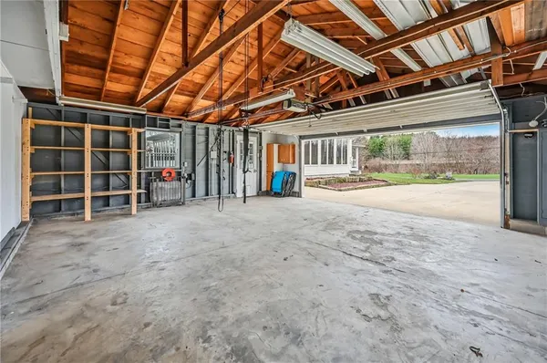 a view of an empty room with wooden walls