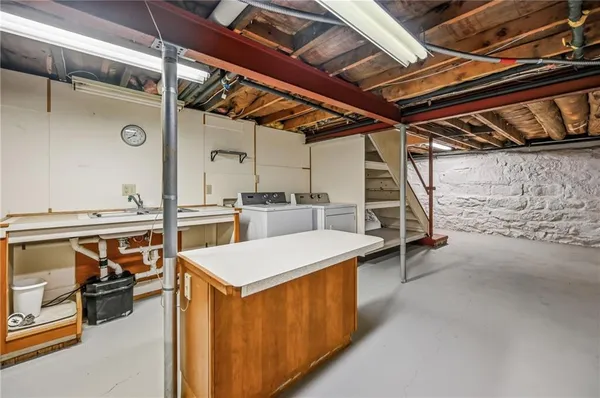 a utility room with a wooden floor