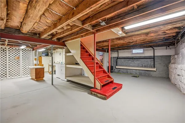 a view of storage and utility room with stairs