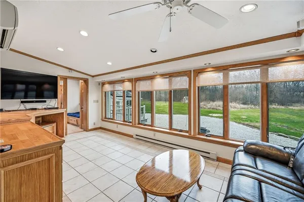a room with furniture and a large window