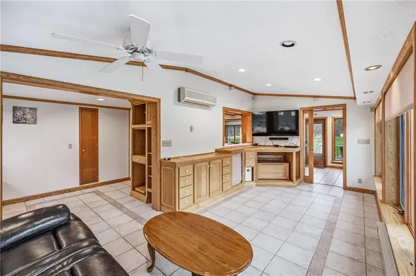 a open kitchen with stainless steel appliances granite countertop a stove and a sink