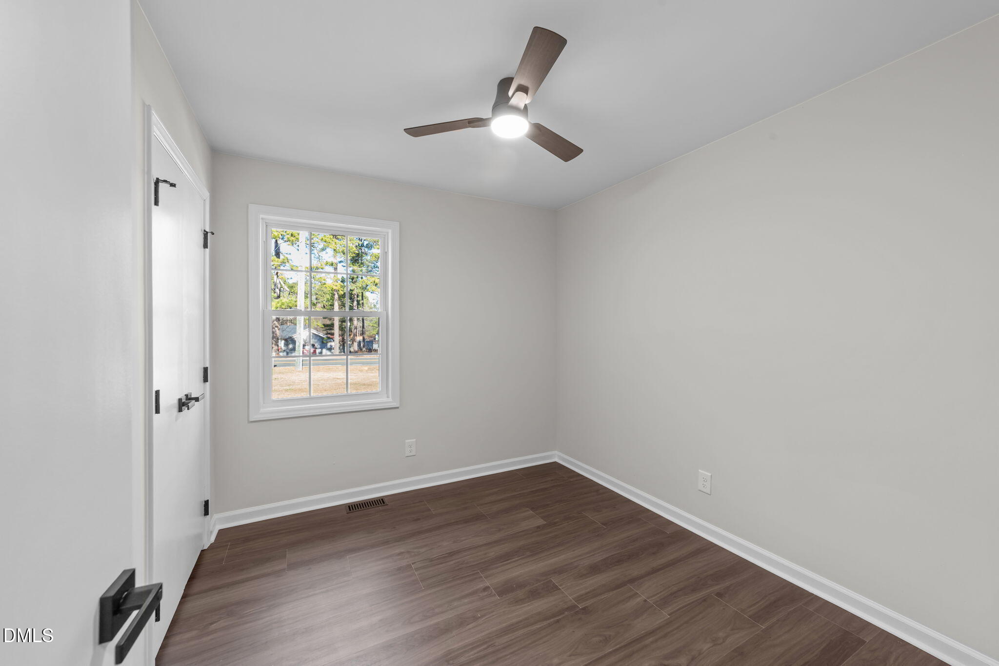 934 Old Zebulon Road Wendell, NC 27591 - Photo 13 of 26 wooden floor in an empty room with a window