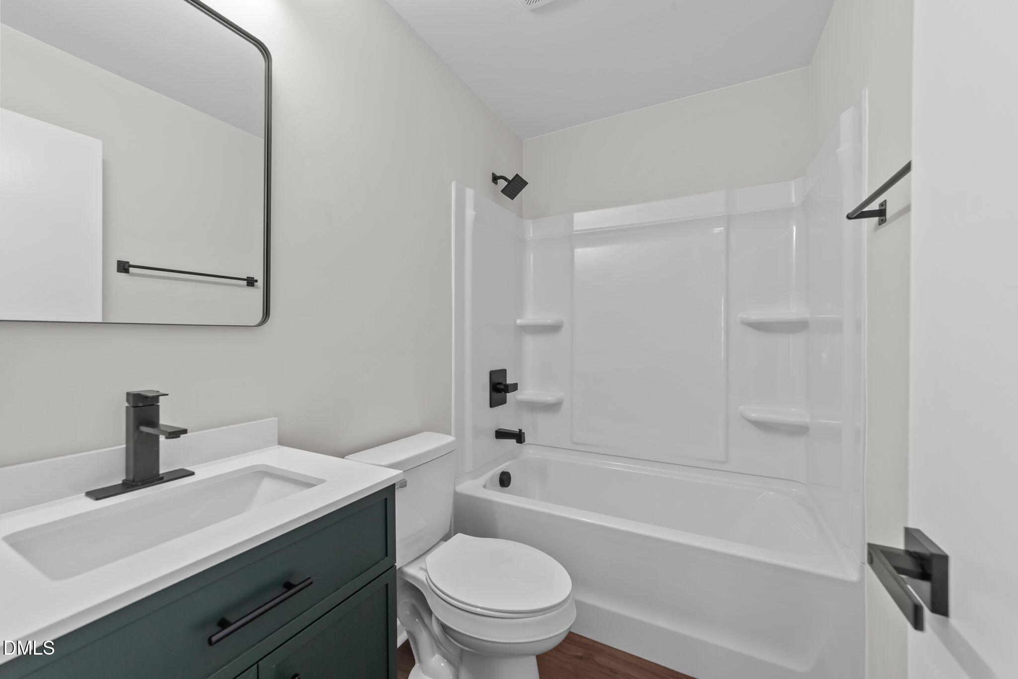 934 Old Zebulon Road Wendell, NC 27591 - Photo 16 of 26 a bathroom with a sink a toilet and a bathtub