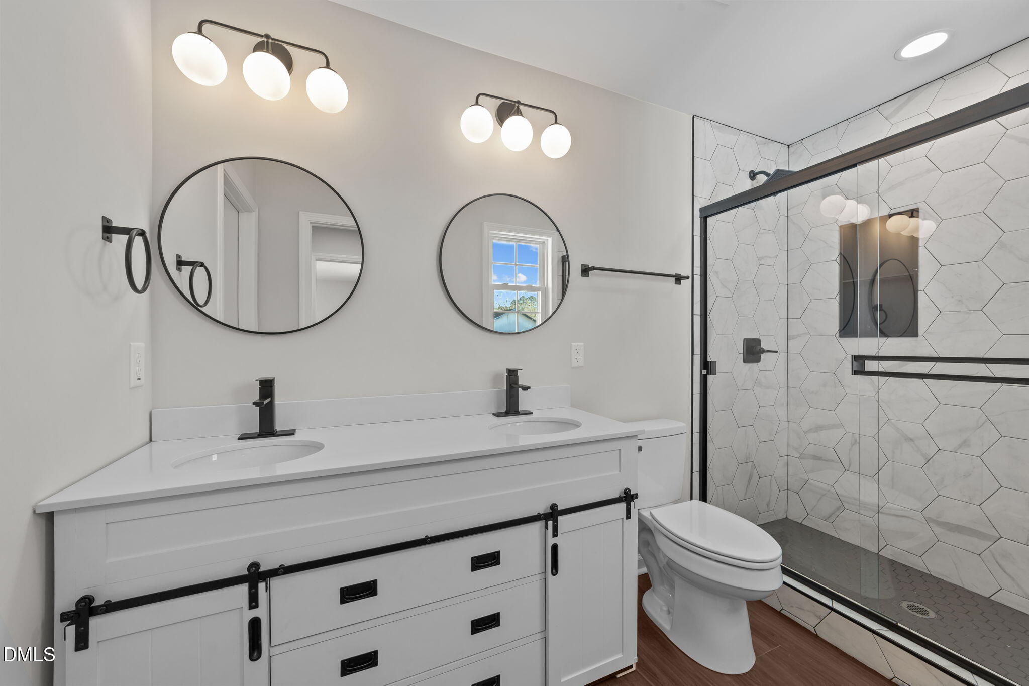 934 Old Zebulon Road Wendell, NC 27591 - Photo 20 of 26 a bathroom with a toilet a sink and a mirror