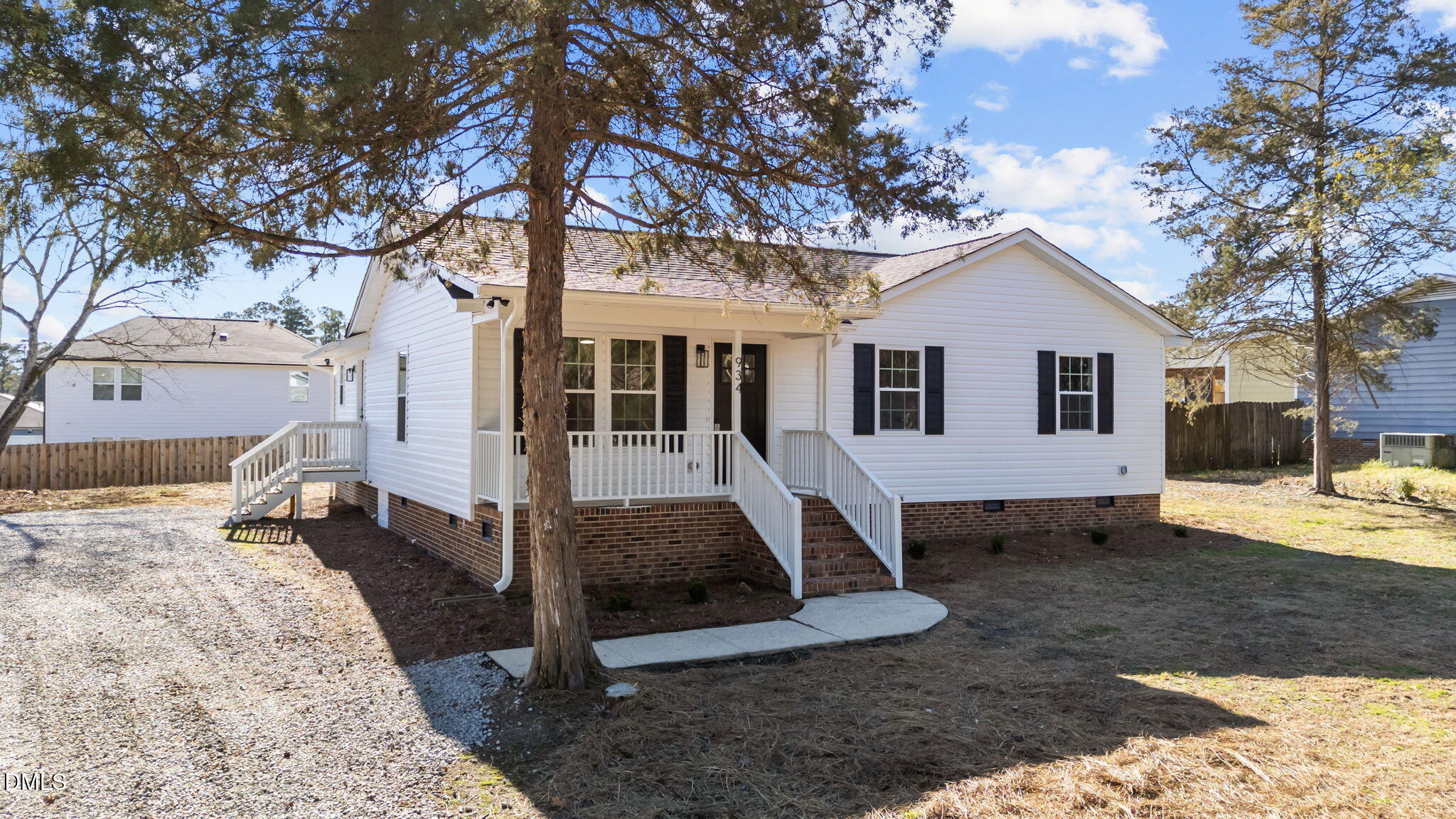 934 Old Zebulon Road Wendell, NC 27591 - Photo 2 of 26 a front view of a house with a yard outdoor seating and yard