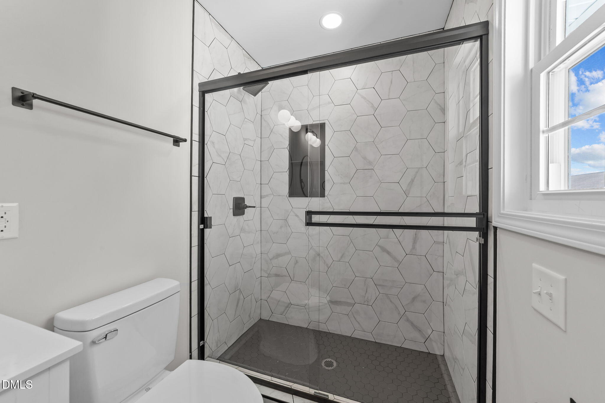 934 Old Zebulon Road Wendell, NC 27591 - Photo 21 of 26 a bathroom with a shower and a toilet