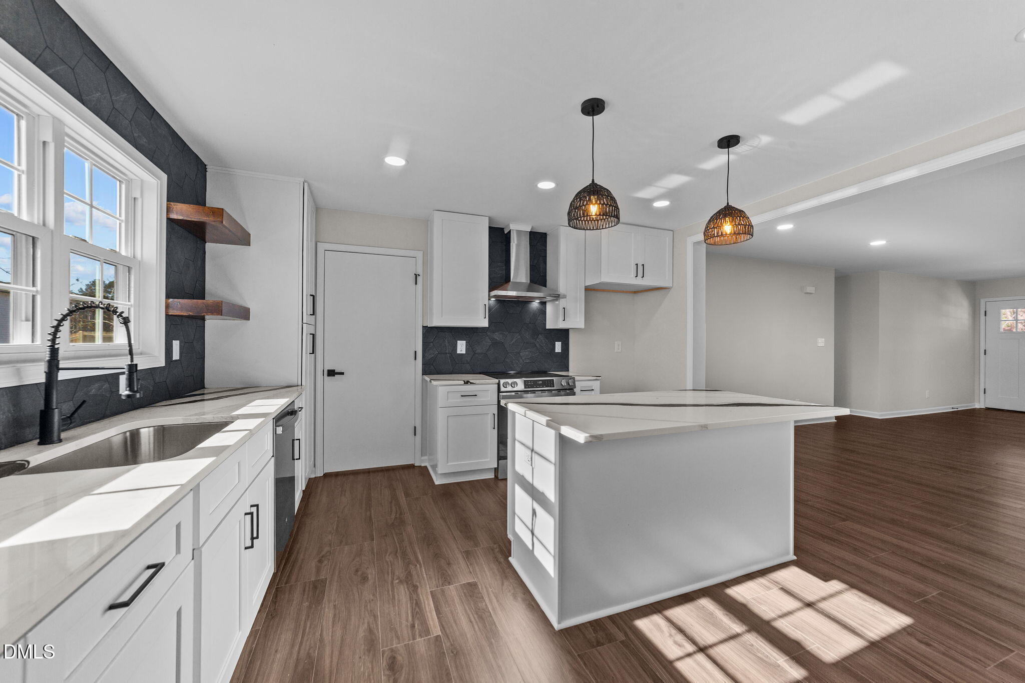 934 Old Zebulon Road Wendell, NC 27591 - Photo 8 of 26 a kitchen with stainless steel appliances granite countertop a sink stove and refrigerator