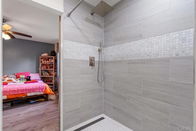a bathroom with a sink vanity mirror and toilet