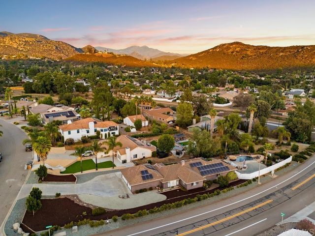 an aerial view of residential houses and street view