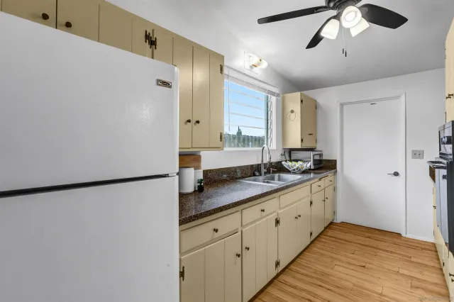 a bathroom with a double vanity sink and mirror