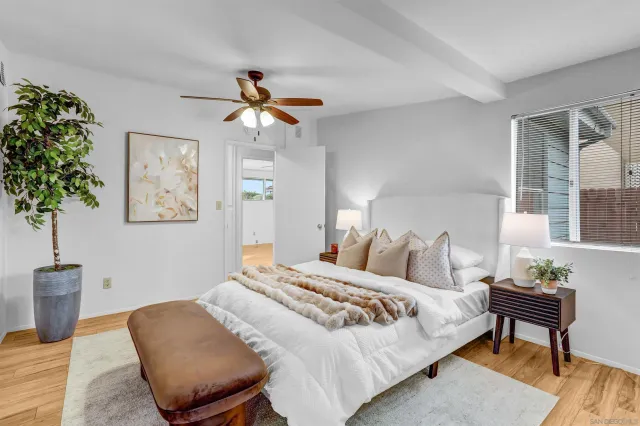 a bedroom with furniture and a chandelier