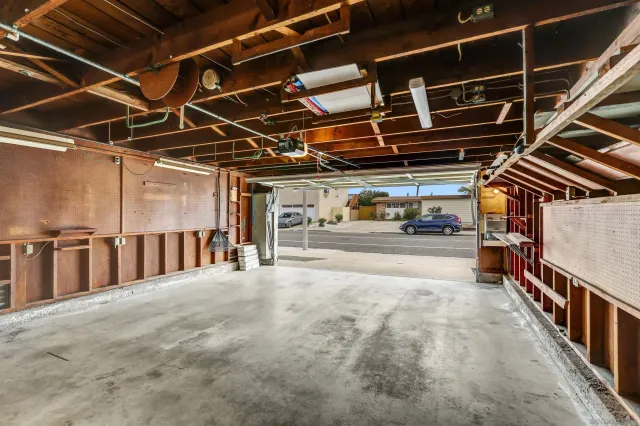 a view of an empty room with wooden walls
