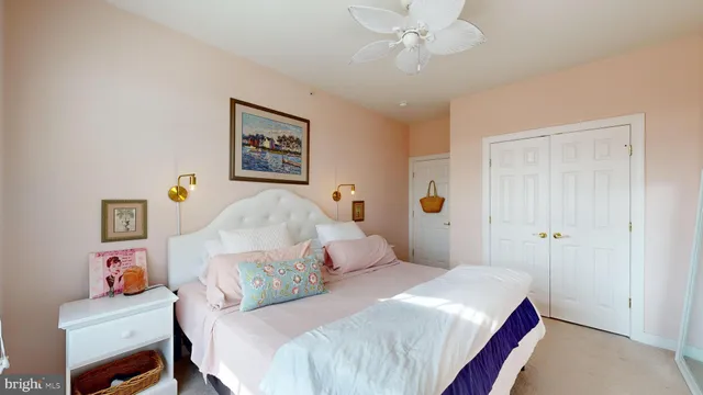 a bedroom with a bed and a potted plant