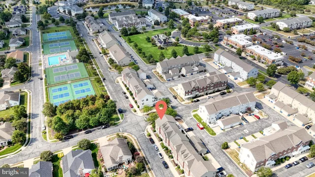 front view of a brick house with a yard