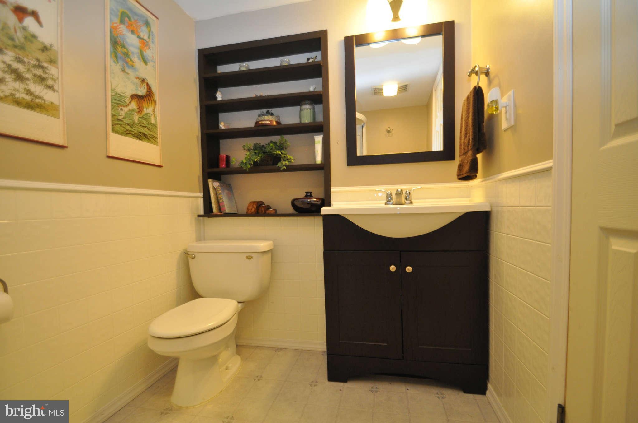 2900 Gillis Road Mount Airy, MD 21771 - Photo 22 of 26 a bathroom with a sink a toilet and mirror