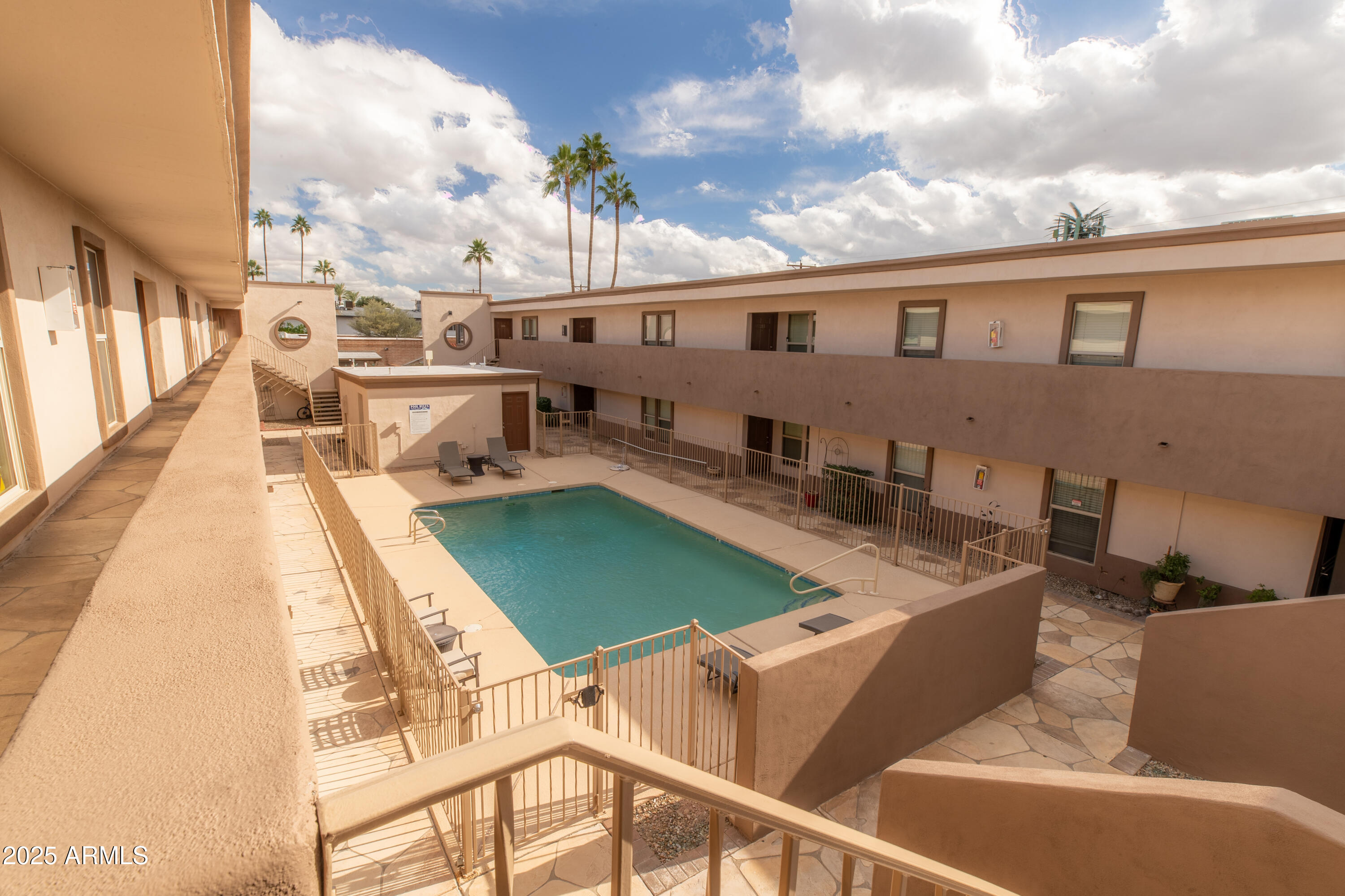 3619 East Monterosa Street, Unit 202 Phoenix, AZ 85018 - Photo 1 of 20 a balcony with table and chairs