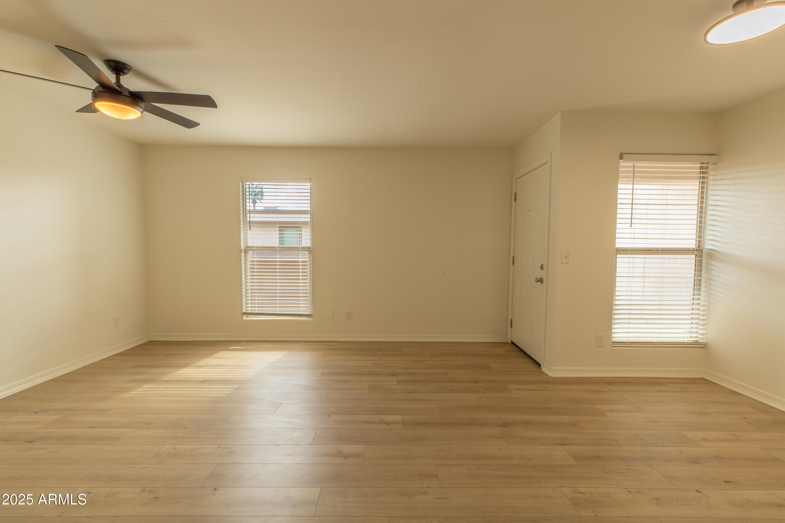 3619 East Monterosa Street, Unit 202 Phoenix, AZ 85018 - Photo 12 of 20 a view of an empty room with a window