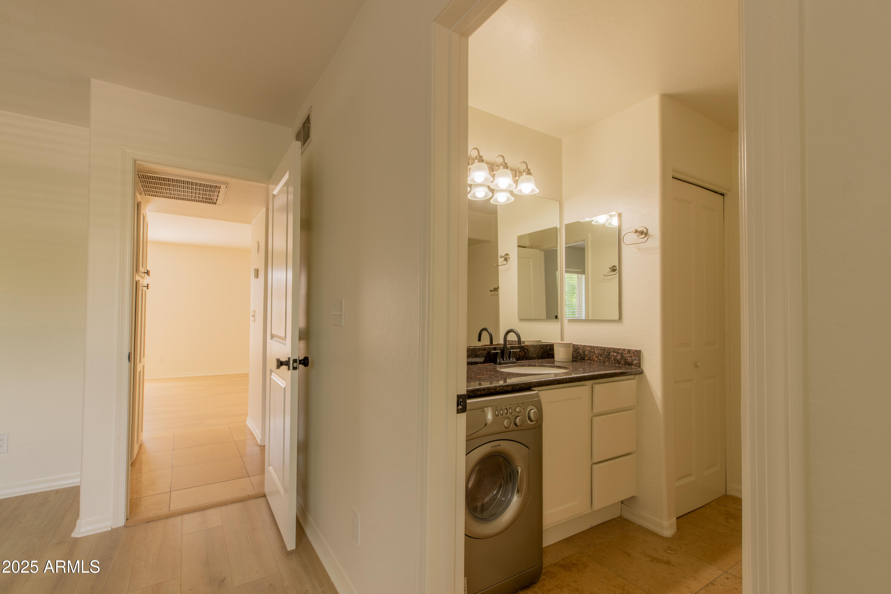 3619 East Monterosa Street, Unit 202 Phoenix, AZ 85018 - Photo 19 of 20 a room with a washing machine and a sink