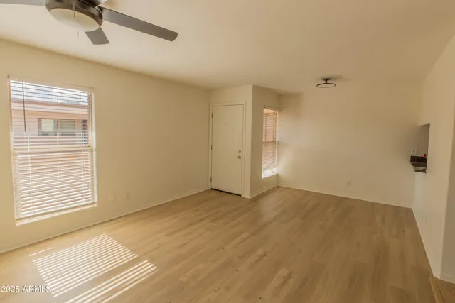 a view of an empty room with a window